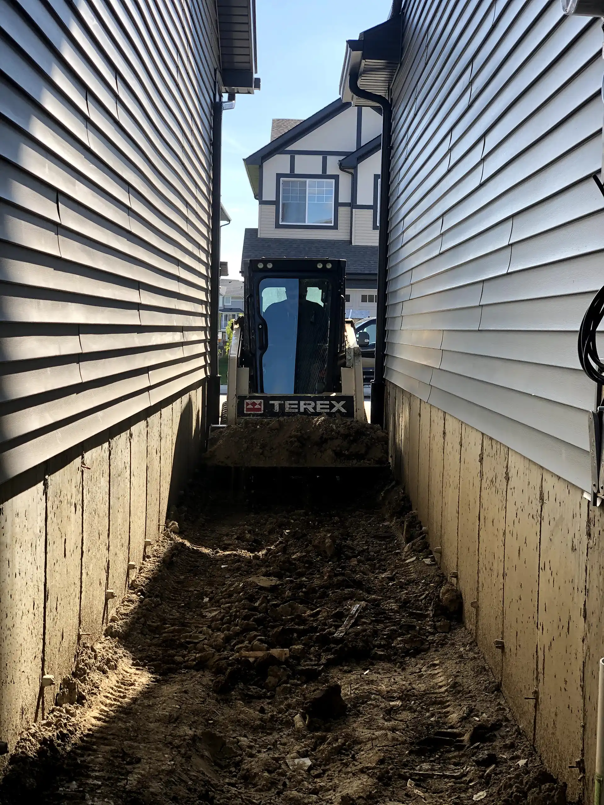 Rough grading zero lot line in Edmonton